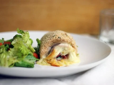 Chicken breasts stuffed with ham, broccoli and mozzarella