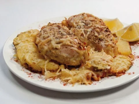 Chicken breasts baked in cream under cheese